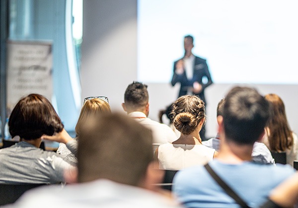 Speaker Giving A Talk At Conference Event.